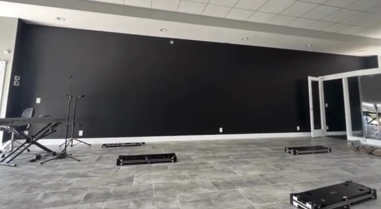 Bare black sanctuary wall before the LED install