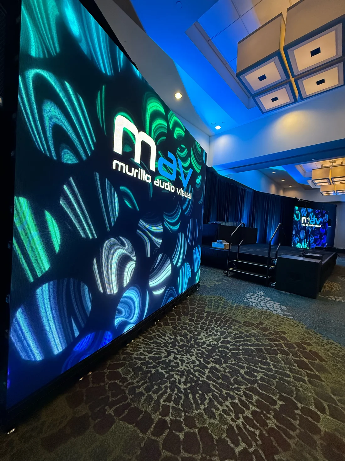 LED wall with the MAV logo in an Orlando ballroom